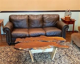 Chateau D’Ax leather couch in background and live edge coffee table. Carpet not for sale