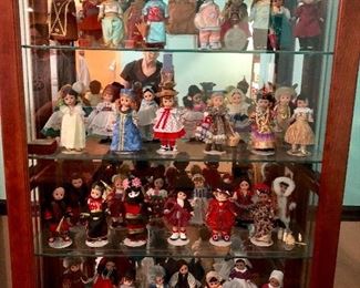 Jasper curio cabinet ( 1 of 2 )and large collection of Madame Alexander dolls