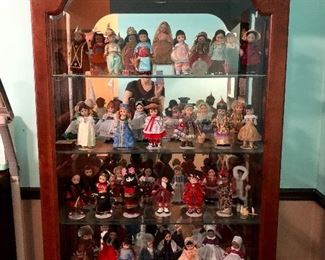 1 of 2 Jasper curio cabinets. Large doll collection. 