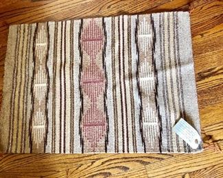 Native American woven rug with tags