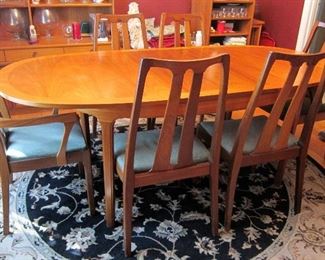 NATHAN DINING TABLE AND 6 CHAIRS WITH LEAF EXTENED.
