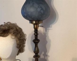 Very tall, beautiful blue lamp.
