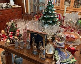Lots of Christmas, and plenty of help in entertaining. The table is oak and has six chairs.