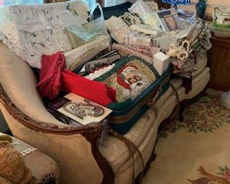 These are loads of table runners, place mats, runners, and two suitcases full of brand new sets of curtains. Bring your measurements because you can find it here.