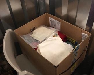 Box of Linens and a chair
