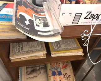 Closeup of National Geographic Magazines, Sheet music other Ephemera including old paper place mats.