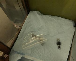 Two shelves- wrapped, pegs, lock & key for display cabinet.