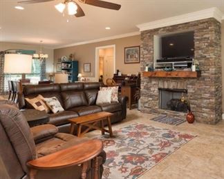 Open Space brings great furniture.  This three cushion sofa is like new and is priced to sell first day. Showcased with floral area rug, small wood bench serves as a table for that perfect cup morning coffee or afternoon tea.