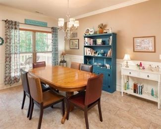 Closer look at the beautiful Dining Room featuring Turquoise Hutch, Off-White Serving Table, with Oak Dining Room Table Set off with Leather Parsons Chairs. 