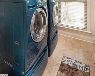 Two Matching Washer/Dryer Combo Front Loaders with extra Drawer Storage.