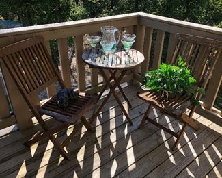 Cool and Cosy explains this setting featuring Slat Wood Table and Matching Chairs. Great for those evening with Pitcher and Matching Glasses.