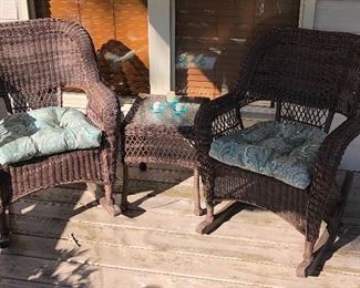 Relaxing on the Deck with this 3-Piece Brown Wicker Set featuring a Wicker Rocker, Chair and Table with Glass Top