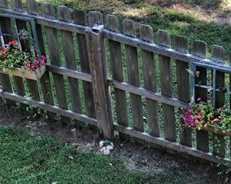 Custom hand made Window Flow Boxes featured on the fence.