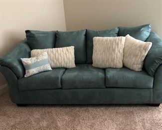 Three Cushion Rolled Arms Sofa with Pillow Back and decor Pillows in the front.