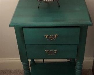 Repurposed Pop-Of-Color Small End Table matches the color scheme throughout this home.