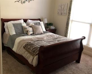 Queen Size Mahogany Sleigh Bed and has a matching Side Table and Dressers.  