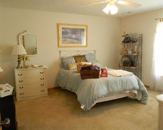 Iron bed has foot board and side rails not shown~ Complete bed and mattress does not include bedding)
