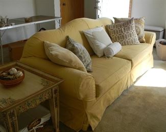 $68 Sunny yellow couch is slip covered with a wine colored fabric underneath~ $68