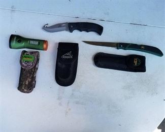 2 Knives and a flashlight all with holsters