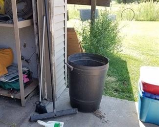 trash cans and brooms