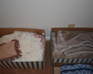 Lots of different blankets and coverlets