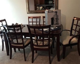 Beautiful Cherry finish dining room table and 6 chairs. Mirror s a nice weight. Not too heavy.