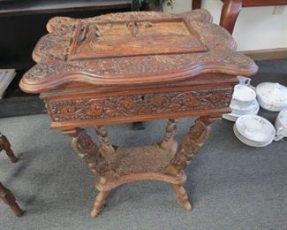 Antique carved wood black forest sewing/work table.