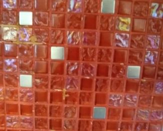 Glass tile in boxes left over from her kitchen project.