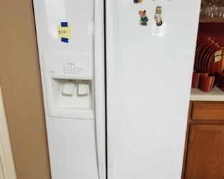 Whirlpool Gold Refrigerator with water dispenser and ice maker. 36 inches,wide, 70 inches tall, 30 inches deep.