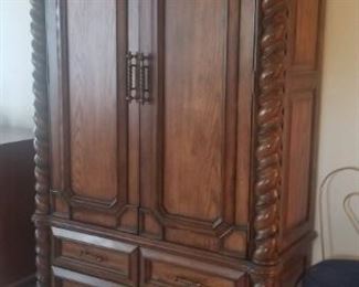 Armoire upper cabinet houses TV 4 drawer below