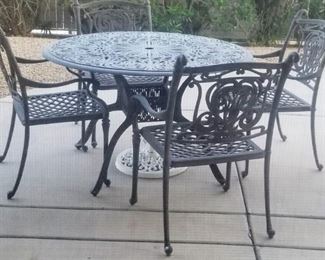 Contemporary patio set Gray powder coated metal round patio and 4 metal arm chairs