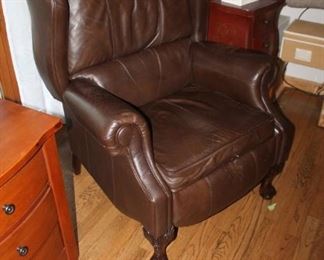 Brown leather reclining arm chair