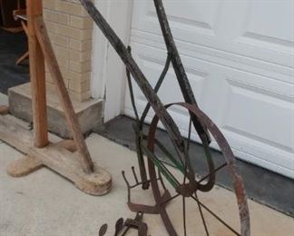 Antique garden plow with a couple extra attachments