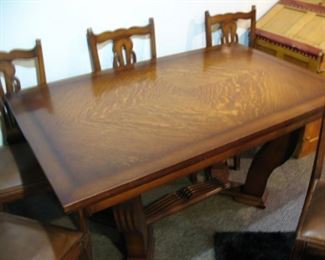 Vintage oak table - original condition and built-in leaves pull out on each end....5 chairs come with! 