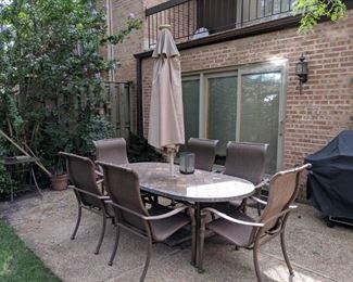 Table, chairs, umbrella and marble umbrella base