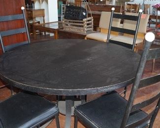 round black table with 4 chairs