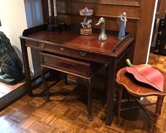 Writing desk is sold ..Display table and small round table are sold