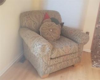 Family room chair that has a matching ottoman