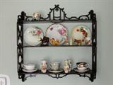 Ornate mahogany wall shelf and whatnots.