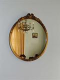 Gilt frame wall mirror.