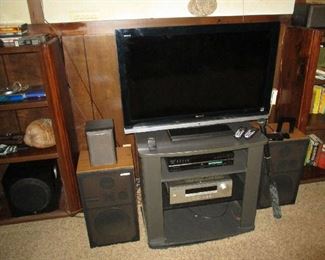 Flat screen TV, stereo equipment, speakers and entertainment center