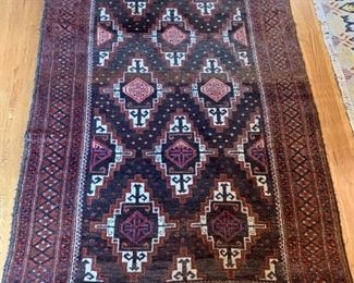39. Hand Knotted Brown and Rust Wool Area Rug (55" x 89")