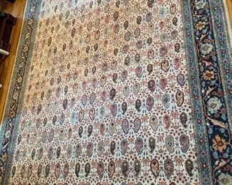 126. Cream, Rust and Blue Hand Knotted Rug (81" x 121")