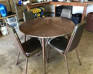 #27 Vintage Table Set with One Leaf and Four Chairs $20
Chairs need to be recovered. The set is sturdy.