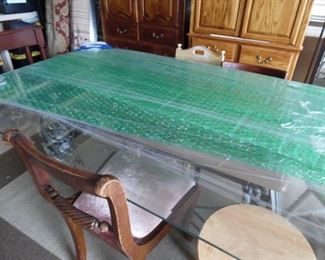 Rectangular glass topped table with metal base