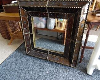 Very ornate mirror with glass panel frame
