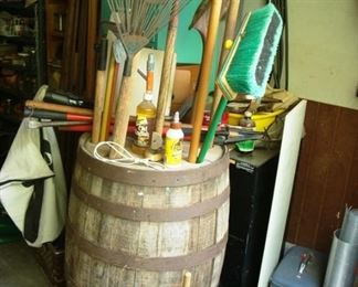 Garage items and oak barrel.