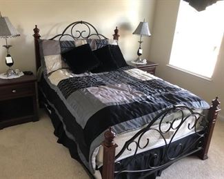 Wood and Iron full size bed.  Bedroom set has matching night stands and dresser and mirror