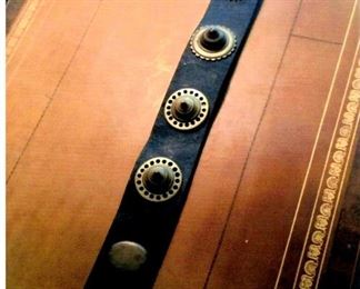 Vintage Leather belt with brass horse medallions affixed thereto