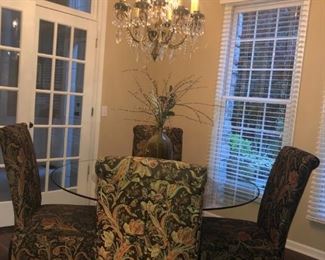ROUND GLASS DINNING TABLE WITH THESE SIX UPOLSTERED SIDE CHAIRS IN EXCELLENT CONDITION